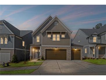Charming two-story home featuring a two-car garage and a well-manicured lawn in a suburban setting at 837 Lakemont Dr, Canton, GA 30114