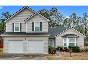 Charming two-story home featuring a two-car garage and well-maintained landscaping at 4720 Buffalo St, Fairburn, GA 30213