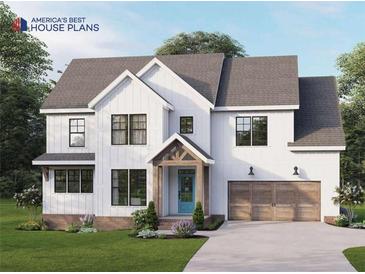 Charming two-story home with vertical siding, a welcoming front porch, and a two-car garage at 554 Palm St, Holly Springs, GA 30115