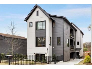 Striking modern home with a two-tone exterior, dark trim, and a well-manicured front yard in a desirable neighborhood at 219 Howell Se Dr # A, Atlanta, GA 30316