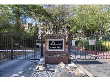 Gated entrance to The Highlands at Akers Mill provides security and privacy for residents at 1303 Highland Bluff Se Dr # 303, Atlanta, GA 30339