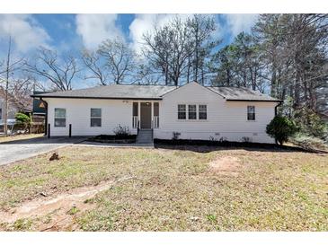 Charming, freshly painted home with a manicured lawn and mature trees offering great curb appeal at 381 Warner Se, Marietta, GA 30060