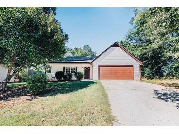 Charming single-story home with a well-maintained lawn, attached garage, and traditional curb appeal at 510 Mountainview Dr, Covington, GA 30016