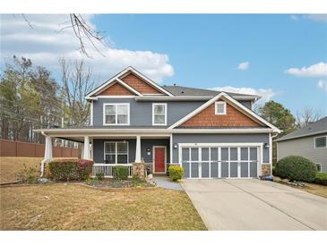 Charming two-story home with a covered porch and a two-car garage at 1699 Boulder Walk Se Dr, Atlanta, GA 30316