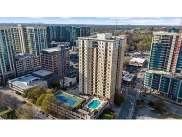 Aerial view of high-rise apartments including tennis court and swimming pool at 325 E Paces Ferry Ne Rd # 504, Atlanta, GA 30305