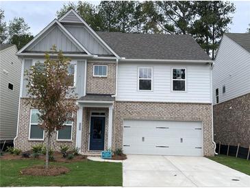 Beautiful brick and siding two-story home with a well-maintained lawn and a two-car garage at 4375 Easter Lily Ave Lot 81, Buford, GA 30519