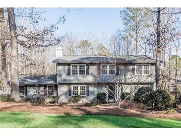 A two-story home with a well-manicured front lawn and mature trees at 2733 Eagle Ridge Rd, Marietta, GA 30062