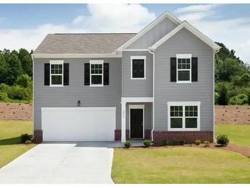 Charming two-story home with gray siding, black shutters, and a well-manicured lawn in a suburban setting at 45 Champions Blvd, Dallas, GA 30157