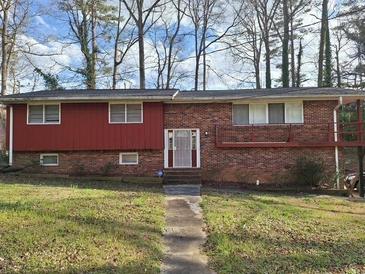 Charming brick home featuring a two-tone exterior and a neatly maintained front lawn at 4625 Diann Dr, South Fulton, GA 30349