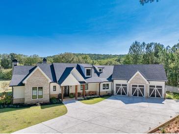 Stunning, newly constructed home with a three-car garage and a long driveway at 441 Pumpkinvine Rd, Acworth, GA 30101