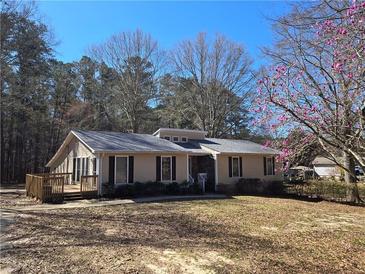 Charming single-story home featuring a welcoming front porch and well-maintained landscaping at 5685 Mccoy Nw Rd, Acworth, GA 30101