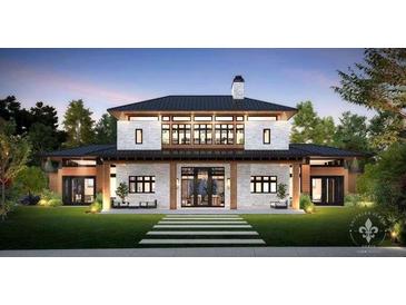Striking two-story home with modern architectural features and professionally landscaped front yard at 4510 Muskogee Ct, Cumming, GA 30040