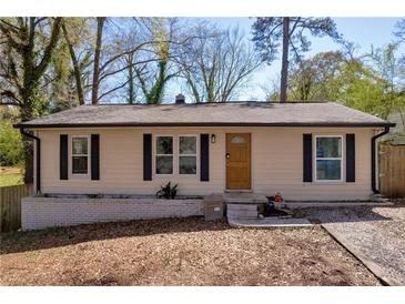 Charming single-story home featuring a well-maintained yard and classic architectural details at 3351 Phillip Cir, Decatur, GA 30032