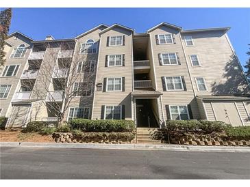 Condo exterior features multiple stories, well-maintained landscaping, and classic architectural details at 1250 Parkwood Se Cir # 2309, Atlanta, GA 30339