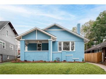 Charming blue bungalow with a well-manicured lawn and inviting front porch at 1453 Hartford Sw Ave, Atlanta, GA 30310