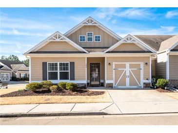 Charming single-story home featuring a well-manicured front yard and a convenient one-car garage at 146 Point View Dr, Canton, GA 30114