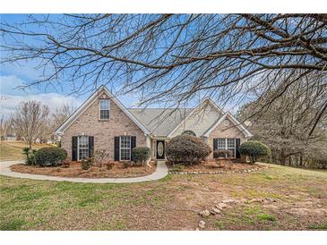 Charming brick home with manicured landscaping and inviting front entrance at 109 Melrose Creek Dr, Stockbridge, GA 30281