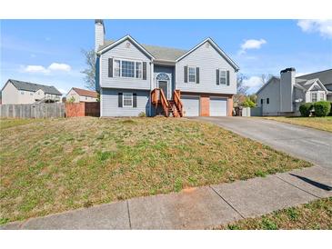 Charming two-story home with a manicured lawn, two car garage, and inviting front entrance at 85 Ann Se Cir, Cartersville, GA 30121