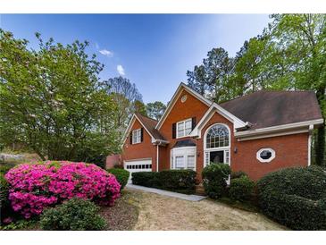 Charming brick home with manicured landscaping and inviting curb appeal at 3117 Kings Arms Ne Ct, Atlanta, GA 30345