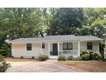 Charming single-story home featuring a welcoming front porch and well-maintained landscaping at 3841 Admiral Dr, Atlanta, GA 30341