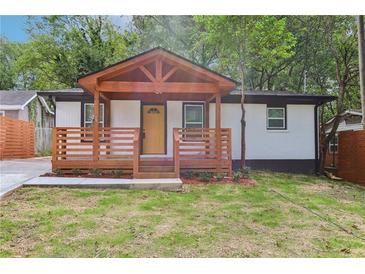 Charming renovated home featuring a covered front porch with beautiful wood beam and painted brick exterior at 2910 3Rd Sw Ave, Atlanta, GA 30315