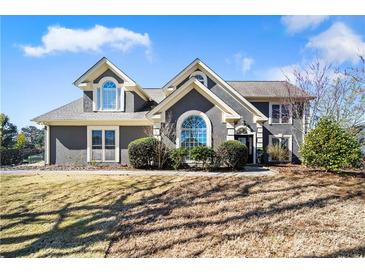 Charming two-story home with a well-manicured lawn and inviting curb appeal at 931 New Bedford, Marietta, GA 30068