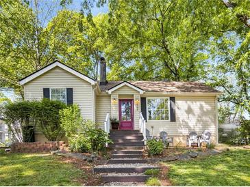 Charming single-story home with a landscaped front yard and inviting entrance at 966 Tilden Nw St, Atlanta, GA 30318