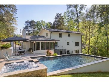Backyard features a pool, hot tub and outdoor seating at 2672 Langland Ne Ct, Atlanta, GA 30345