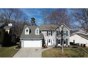 Charming two-story home with gray siding, dormer windows, and an attached two-car garage at 3179 Dunlin Lake Rd, Lawrenceville, GA 30044