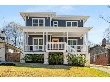 Charming two-story home with a welcoming front porch and well-maintained landscaping at 431 Clifton Ne Rd, Atlanta, GA 30307