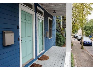 Charming blue home with a covered porch, mailbox and street view at 206 Reinhardt St Se, Atlanta, GA 30312