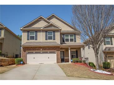 Charming two-story home featuring a brick and siding facade and a two-car garage at 2409 Brynfield Cv, Suwanee, GA 30024