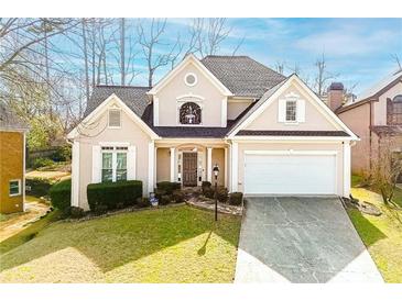 Charming single-Gathering home featuring manicured lawn, attached garage, and inviting front entryway at 2698 Glenrose Hl, Atlanta, GA 30341