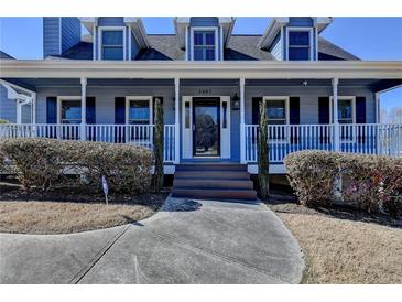 Charming two-story home with a welcoming covered porch and well-maintained landscaping at 2467 Sky Valley Dr, Dacula, GA 30019