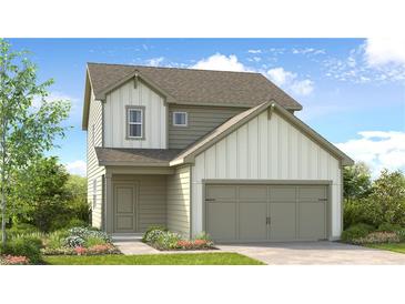 Charming two-story home featuring a modern facade, a two-car garage and lush landscaping at 215 Groveton Ct, Euharlee, GA 30145