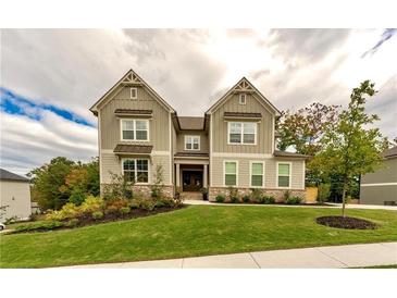 Charming two-story home boasting a well-manicured lawn and craftsman-style details at 427 Parkbrook Way, Canton, GA 30114
