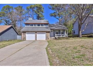 Charming two-story home with stone accents and a two-car garage at 3954 Springleaf Pt, Stone Mountain, GA 30083