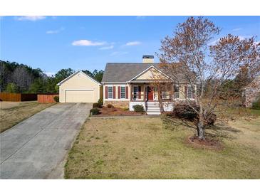 Charming single-Gathering home with a well-maintained lawn and a detached two-car garage at 363 Safe Harbor Dr, Dallas, GA 30157