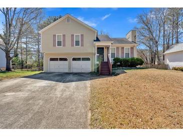 Charming two-story home with a two car garage and a well-manicured front yard at 539 Villa Rosa Rd, Temple, GA 30179