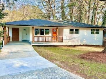 Charming single-story home featuring a welcoming front porch and freshly painted exterior at 2430 Hanford Sw Dr, Atlanta, GA 30315