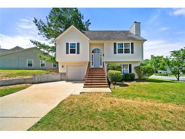 Charming two-story home with a well-maintained lawn and inviting curb appeal at 125 Fairhaven Trl, Fairburn, GA 30213