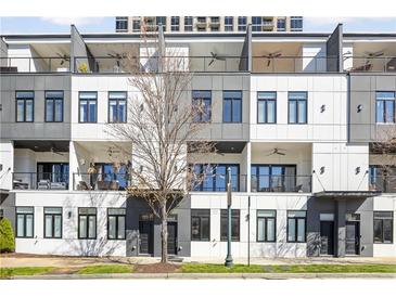Modern townhome exteriors featuring balconies and sleek architectural design at 223 16Th Nw St # 8, Atlanta, GA 30363