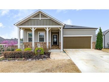 Charming single Gathering home with 1-car garage and manicured front yard at 525 Appalachian Pl, Canton, GA 30114