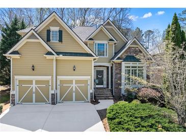 Inviting two-story home with a well-manicured lawn, a two car garage, and stone and siding accents at 1463 Bailey Farm Sw Dr, Marietta, GA 30064