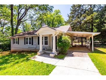 Charming single-story home with a welcoming porch and well-maintained front yard at 2949 Pearl St, East Point, GA 30344