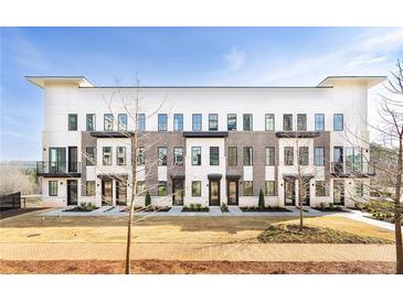 Beautiful modern townhome with a combination of brick and siding at 7230 Summit Pl, Alpharetta, GA 30009