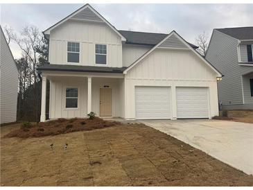 Charming two-story home with a two-car garage and a welcoming front porch at 220 Bloomfield Cir, Canton, GA 30114