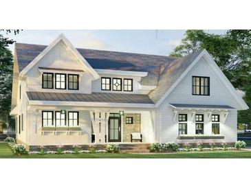 Charming two-story home with a covered porch and beautiful architectural details at 6841 Phillips Mill Rd, Douglasville, GA 30135