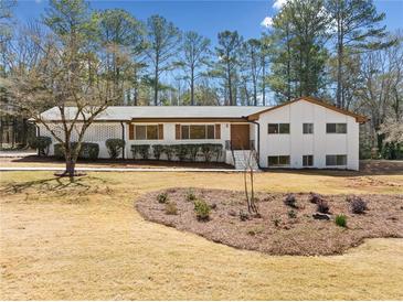 Charming single-story home with white brick and inviting curb appeal at 4562 Anderson Livsey Ln, Snellville, GA 30039