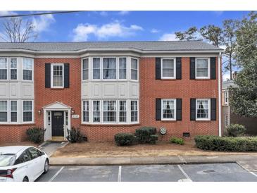 Charming brick townhouse with black shutters and bay windows at 2345 Henderson Mill Ne Rd # 1, Atlanta, GA 30345